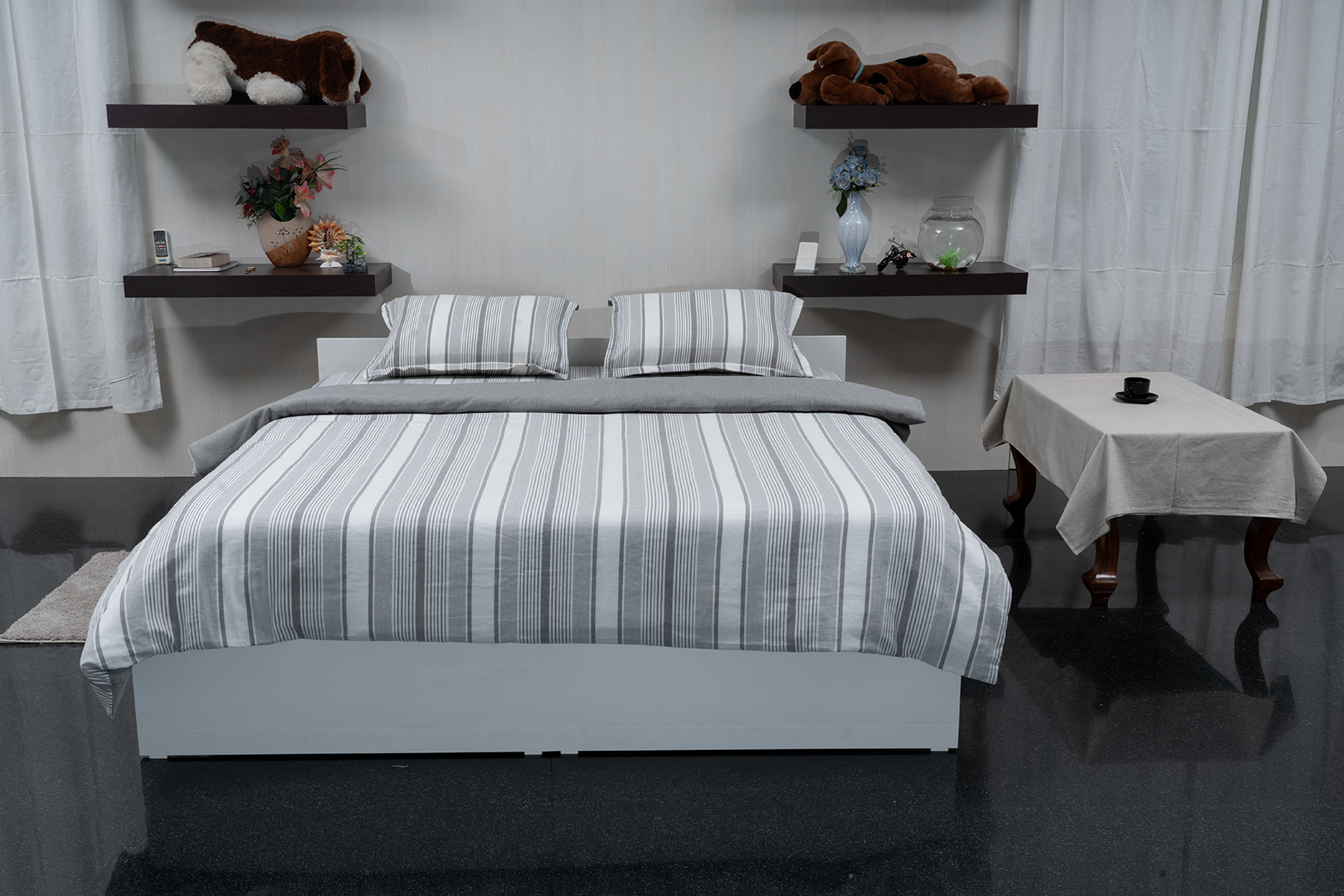 Linn Decors fitted sheet with two pillow covers and quilt styled on a modern bedroom bed