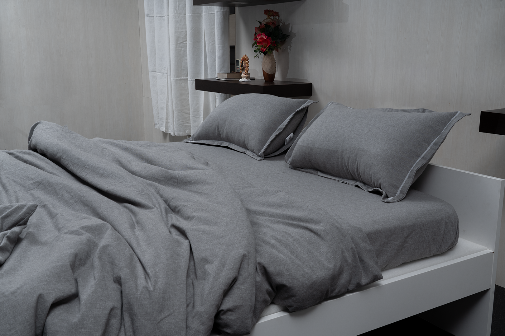 Linn Decors fitted sheet with two pillow covers and duvet cover styled on a modern bedroom bed