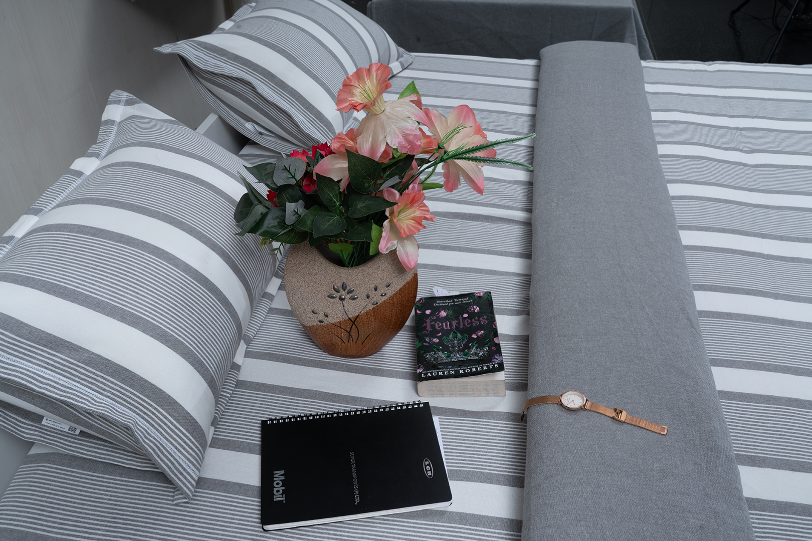 Linn Decors fitted sheet with two pillow covers and quilt styled on a modern bedroom bed