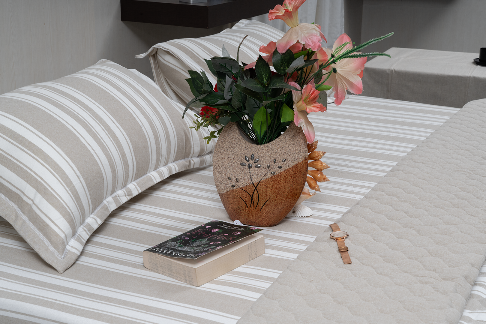 Linn Decors fitted sheet with two pillow covers and quilt styled on a modern bedroom bed