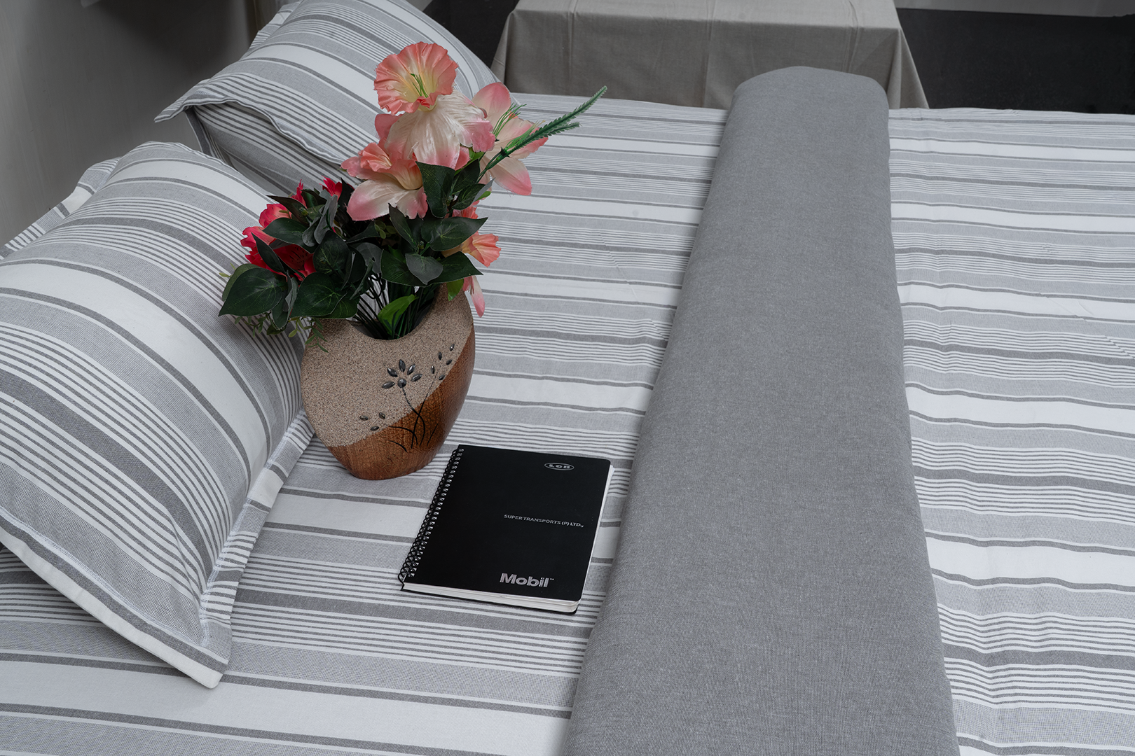 Linn Decors fitted sheet with two pillow covers and quilt styled on a modern bedroom bed