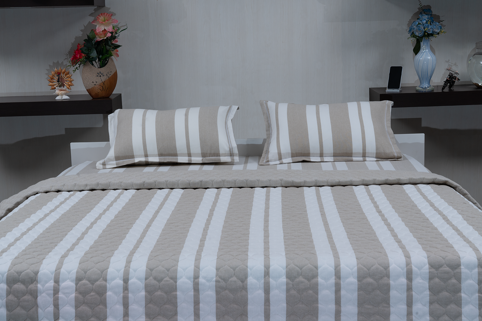 Linn Decors fitted sheet with two pillow covers and quilt styled on a modern bedroom bed
