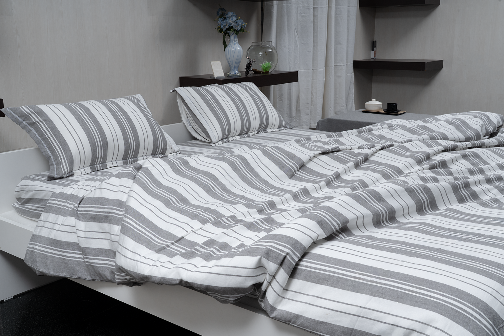 Linn Decors fitted sheet with two pillow covers and duvet cover styled on a modern bedroom bed