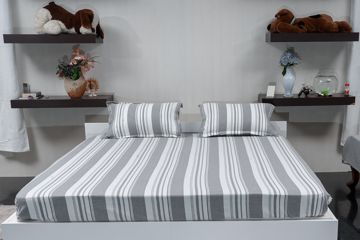 Linn Decors fitted sheet with two pillow covers and duvet cover styled on a modern bedroom bed