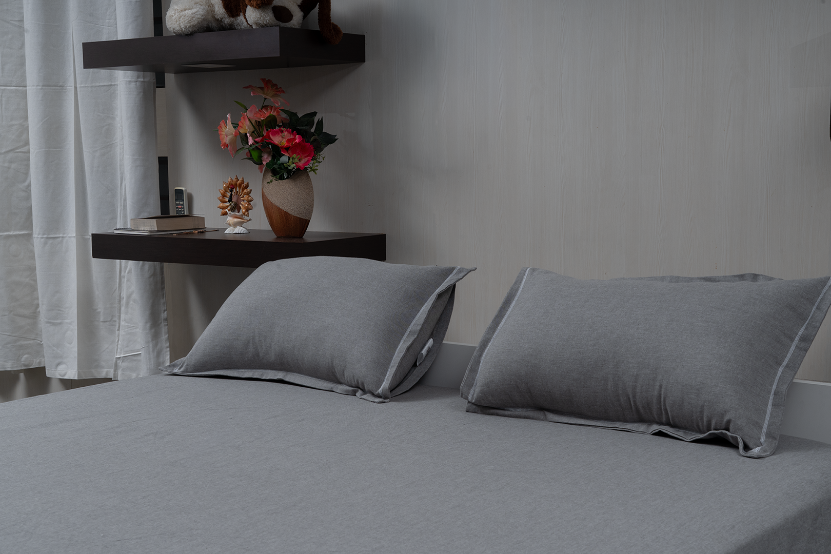 Linn Decors fitted sheet with two pillow covers and duvet cover styled on a modern bedroom bed