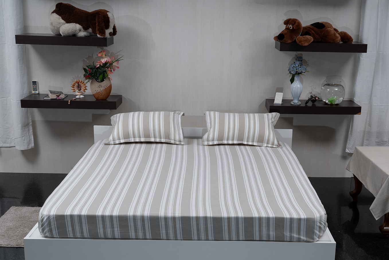 Linn Decors fitted sheet with two pillow covers and quilt styled on a modern bedroom bed