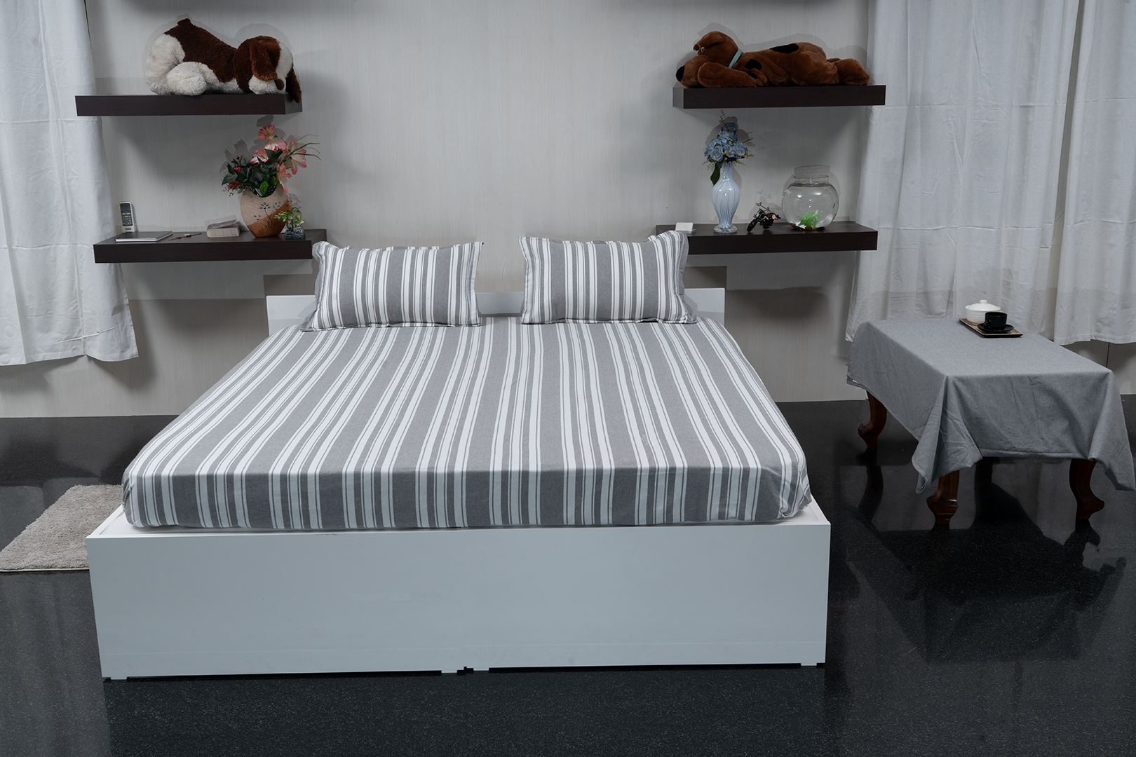 Linn Decors fitted sheet with two pillow covers and quilt styled on a modern bedroom bed
