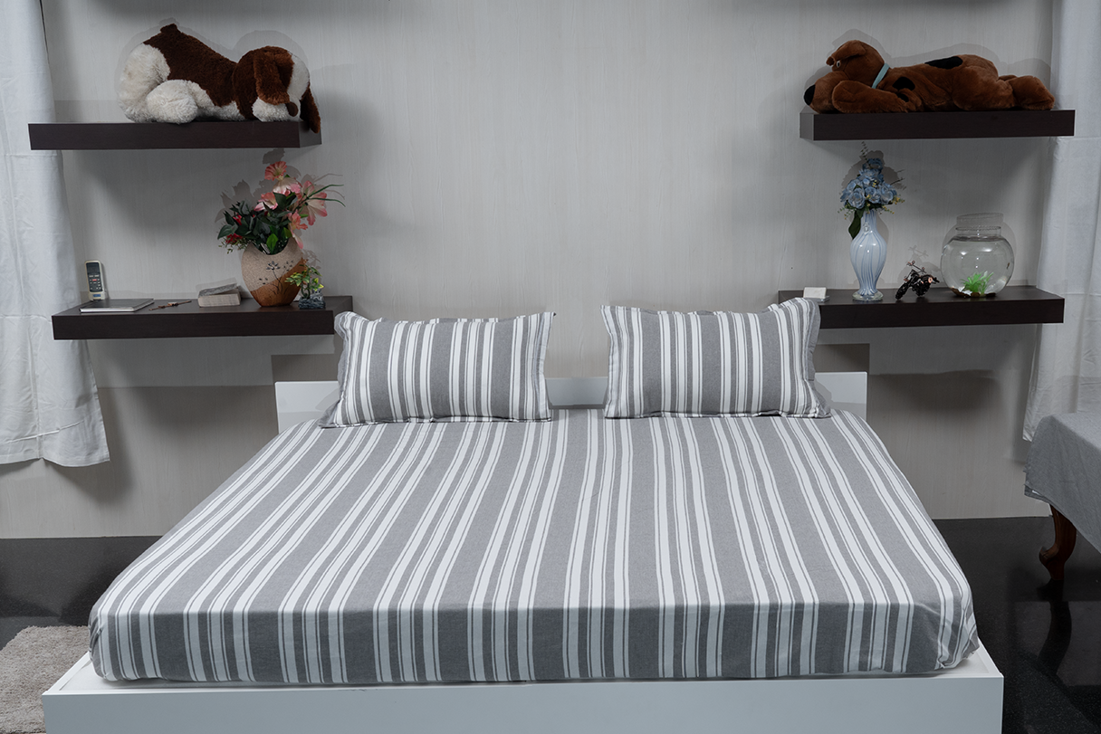 Linn Decors fitted sheet with two pillow covers and duvet cover styled on a modern bedroom bed