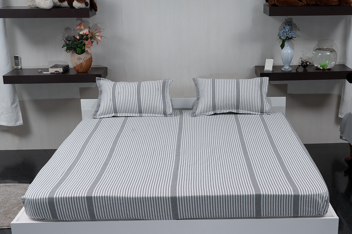 Linn Decors fitted sheet with two pillow covers and duvet cover styled on a modern bedroom bed