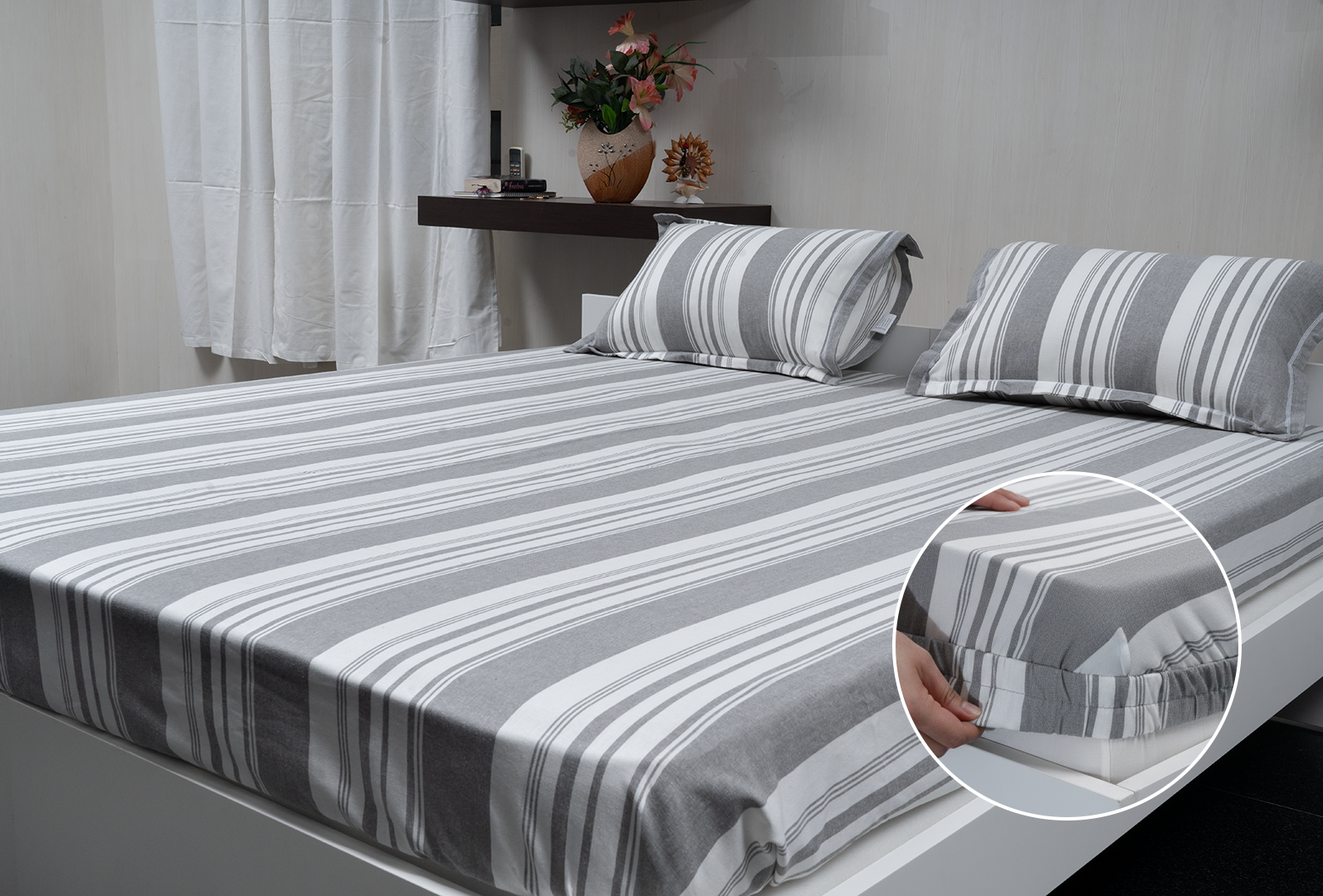 Linn Decors fitted sheet with elastic edges on a modern bed in a clean bedroom setting