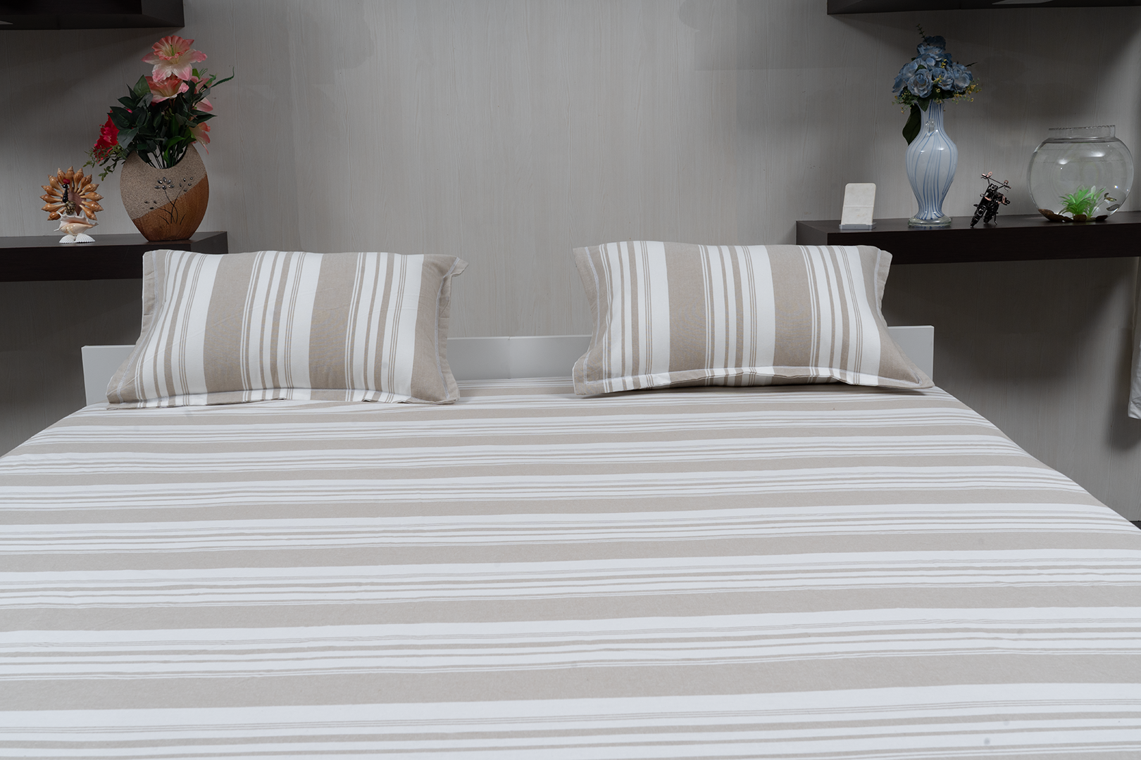 Linn Decors fitted sheet with two pillow covers and quilt styled on a modern bedroom bed