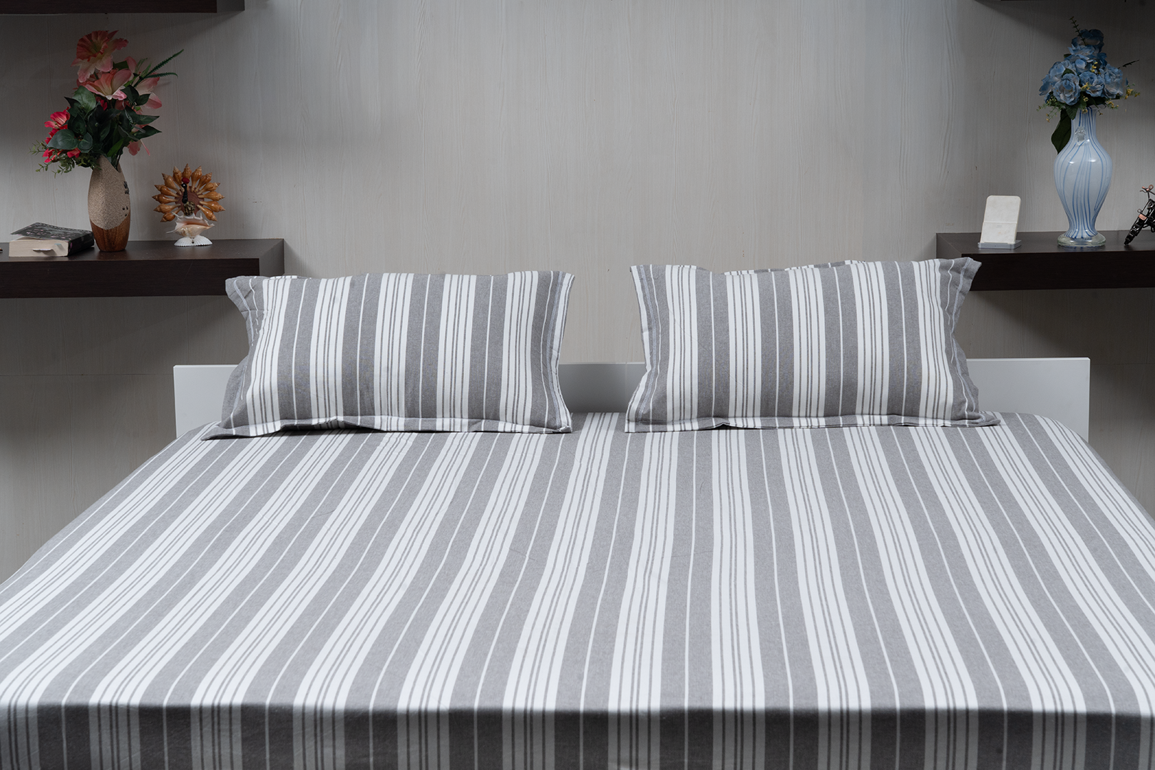 Linn Decors fitted sheet with two pillow covers and duvet cover styled on a modern bedroom bed