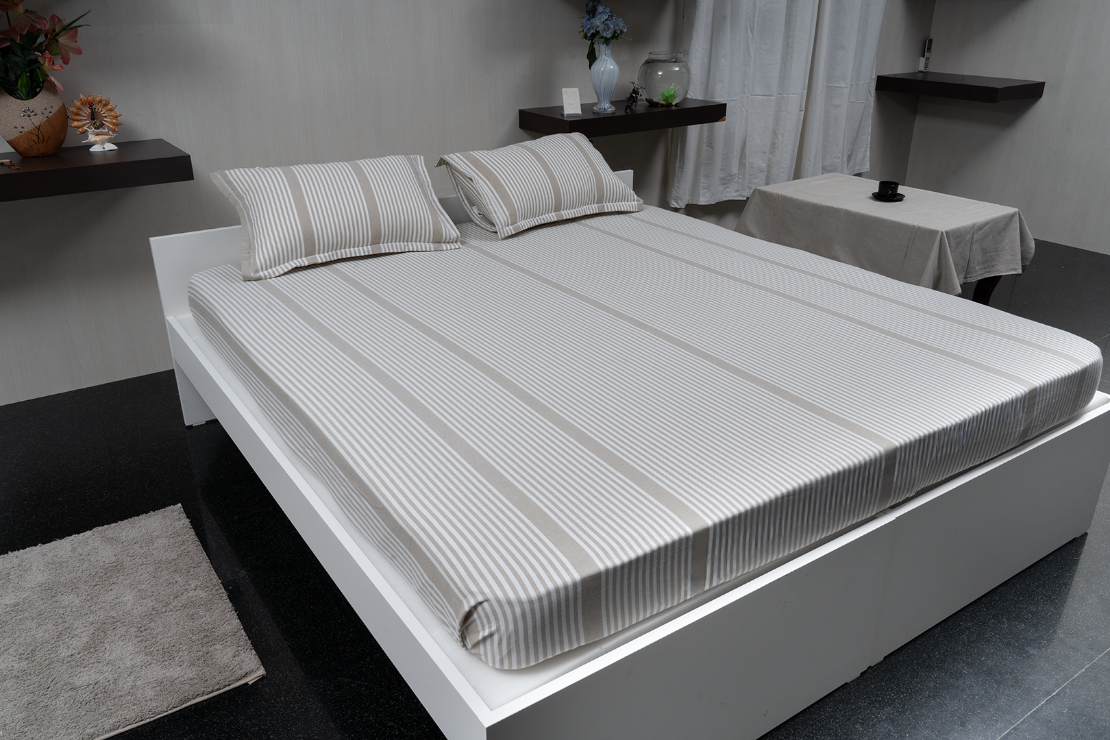 Linn Decors fitted sheet with two pillow covers and quilt styled on a modern bedroom bed