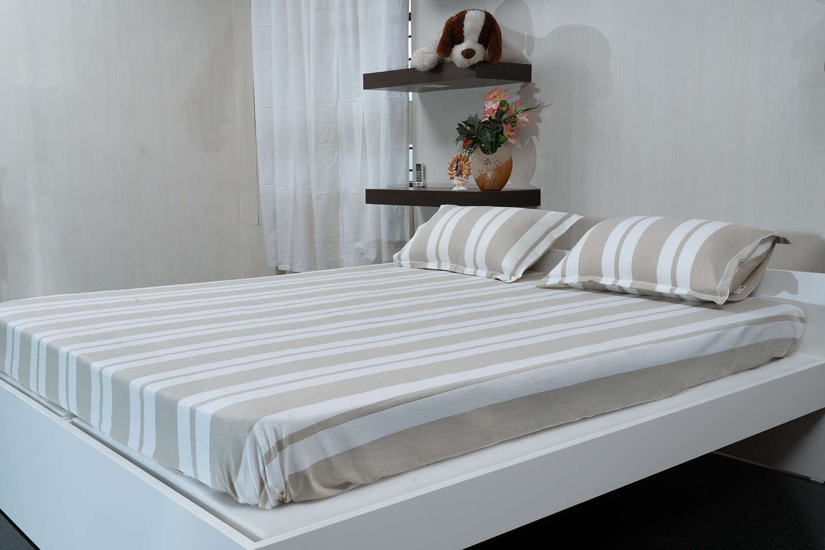 Linn Decors fitted sheet with two pillow covers and quilt styled on a modern bedroom bed