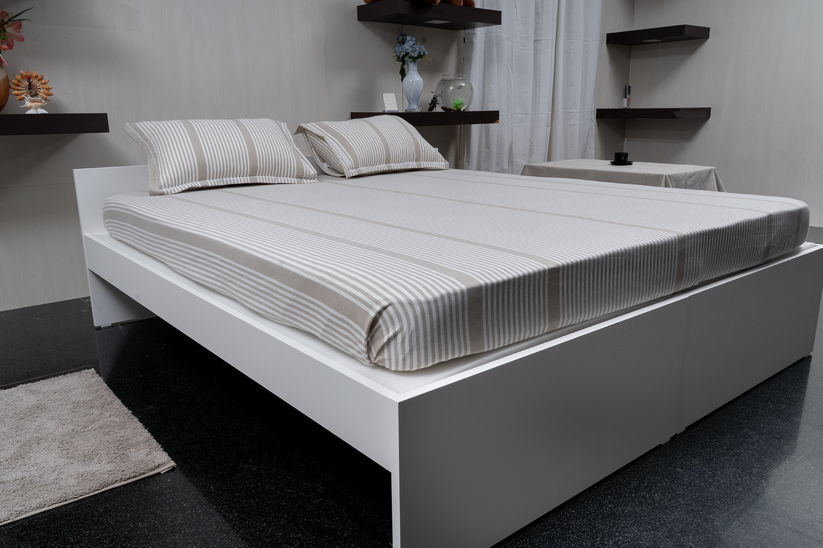 Linn Decors fitted sheet with two pillow covers and quilt styled on a modern bedroom bed