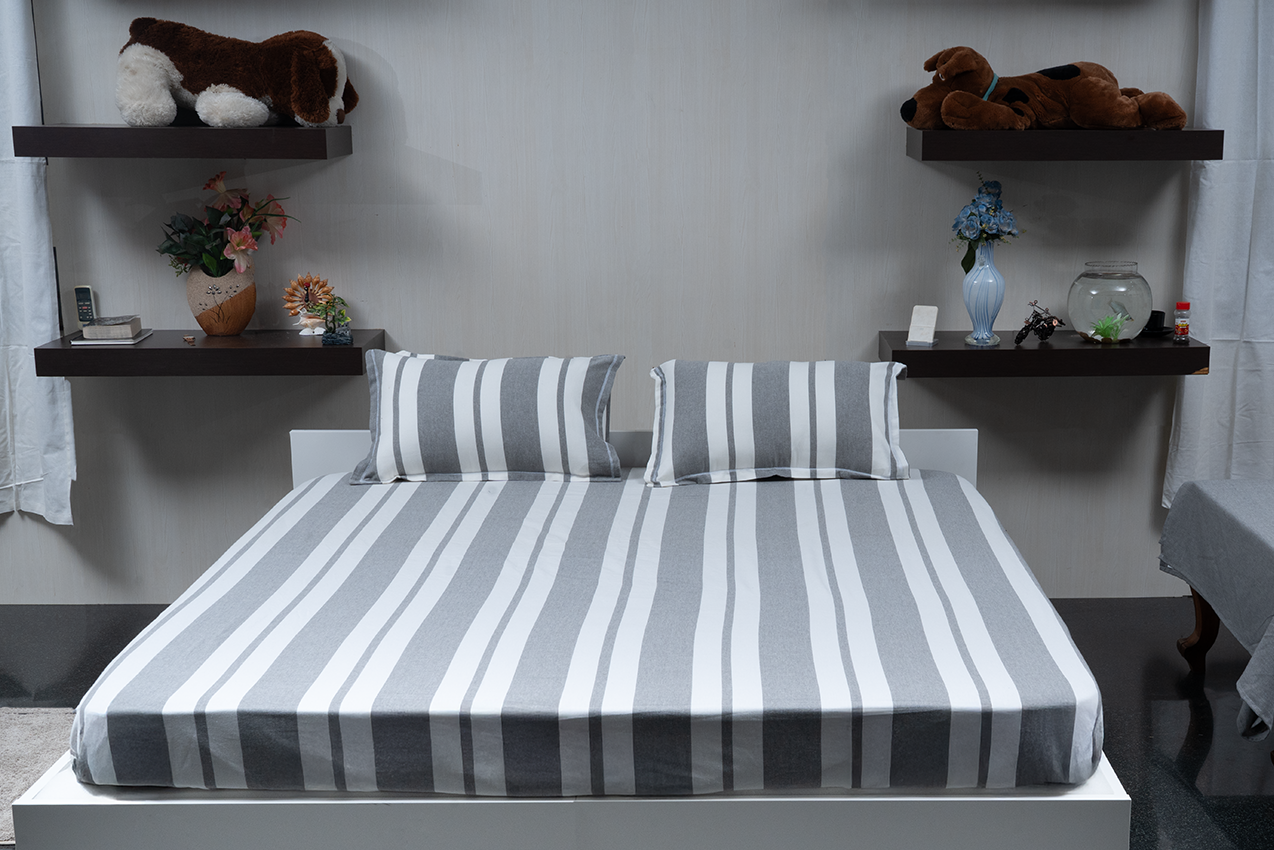 Linn Decors fitted sheet with two pillow covers and duvet cover styled on a modern bedroom bed