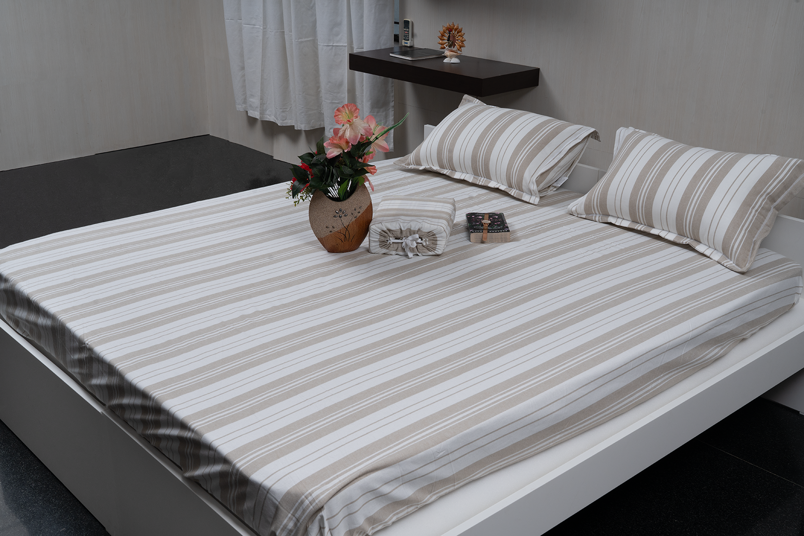 Linn Decors fitted sheet with two pillow covers and duvet cover styled on a modern bedroom bed