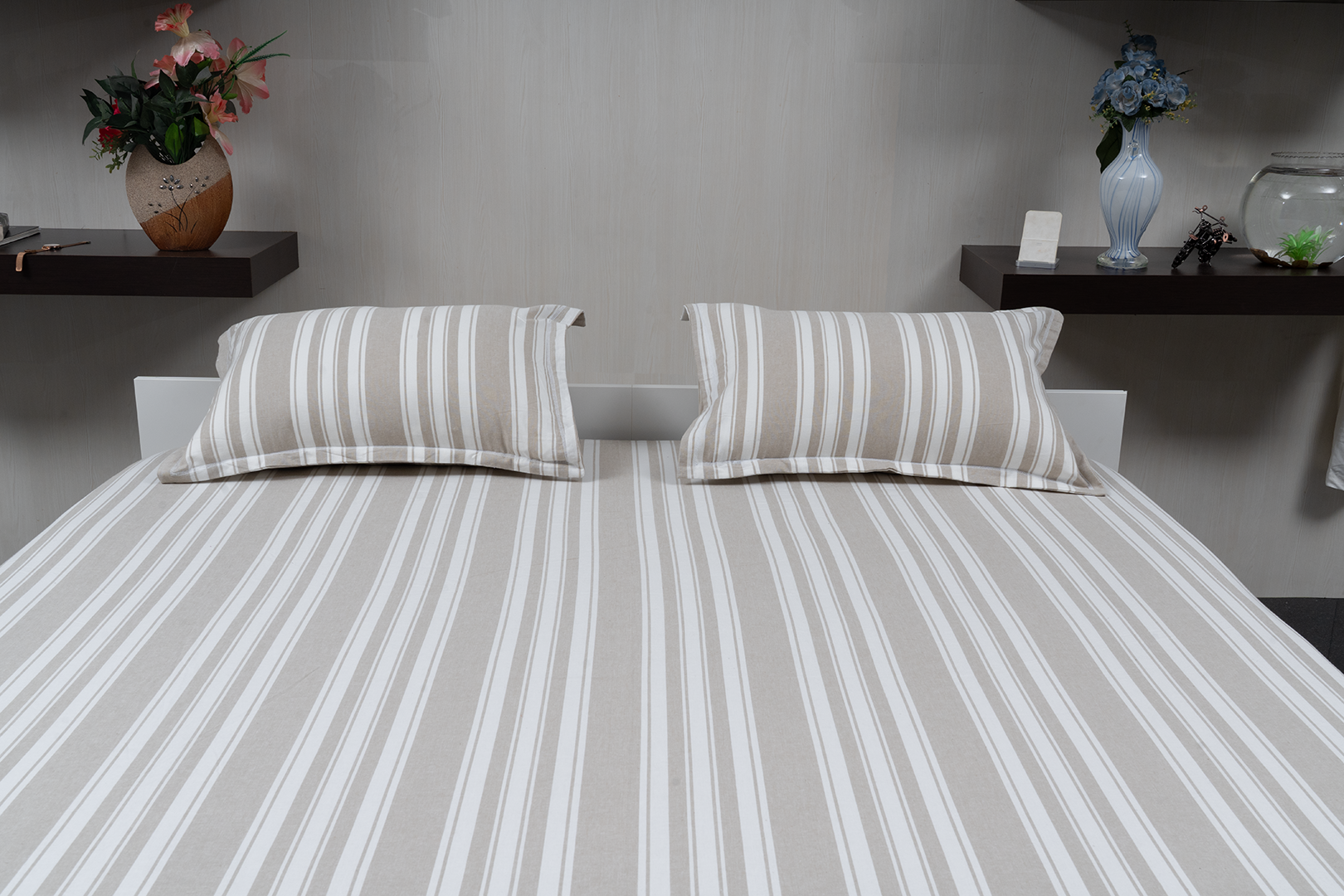 Linn Decors fitted sheet with two pillow covers and quilt styled on a modern bedroom bed