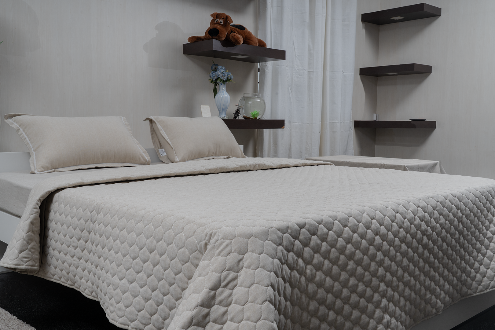Linn Decors fitted sheet with two pillow covers and quilt styled on a modern bedroom bed