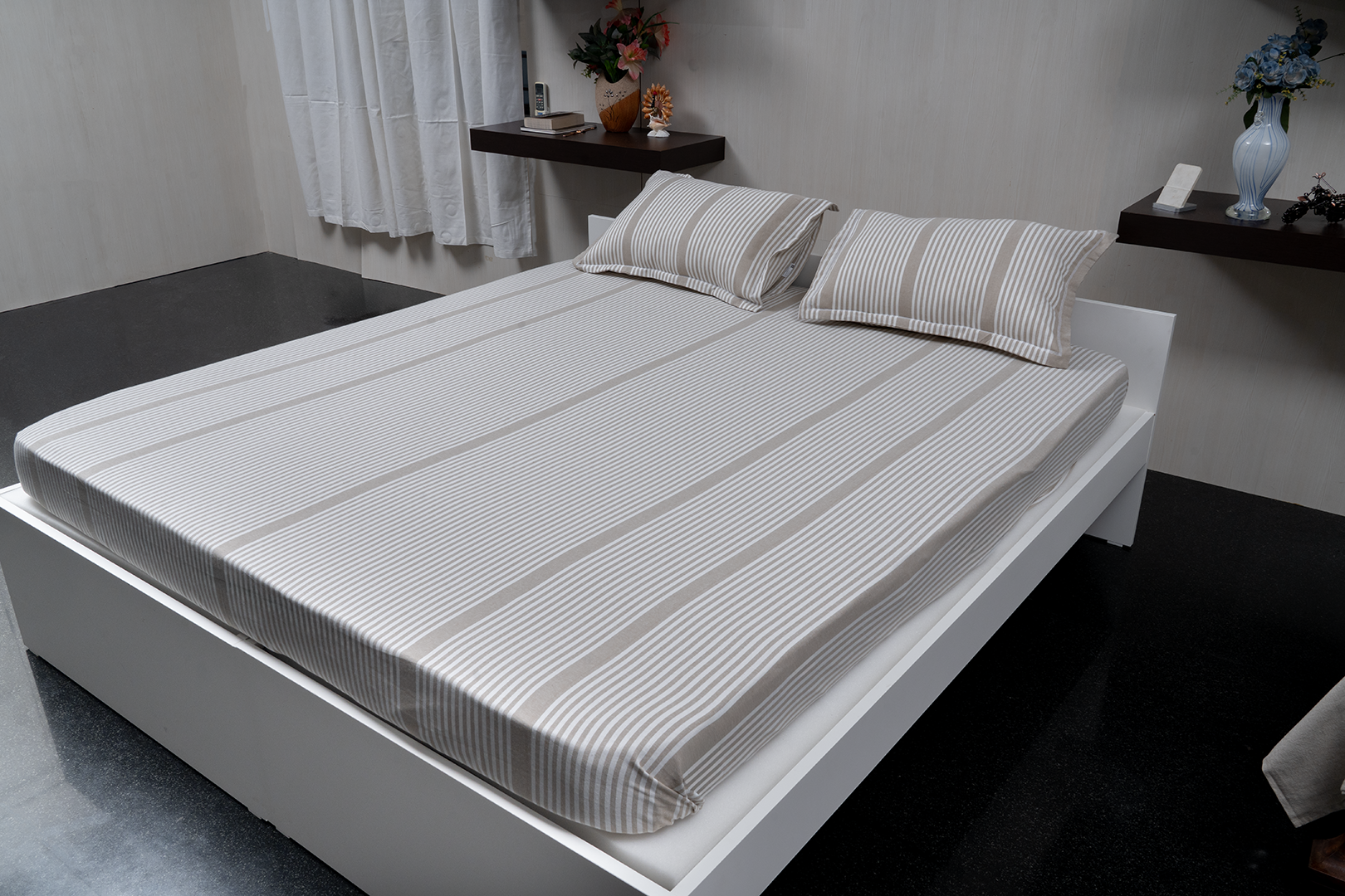 Linn Decors fitted sheet with two pillow covers and quilt styled on a modern bedroom bed