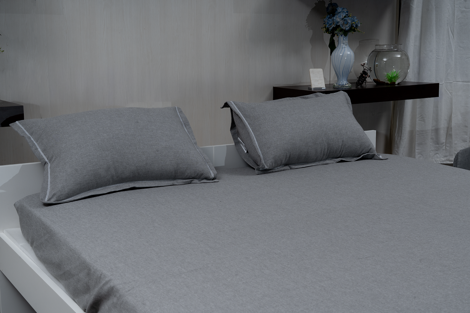 Linn Decors fitted sheet with two pillow covers and duvet cover styled on a modern bedroom bed