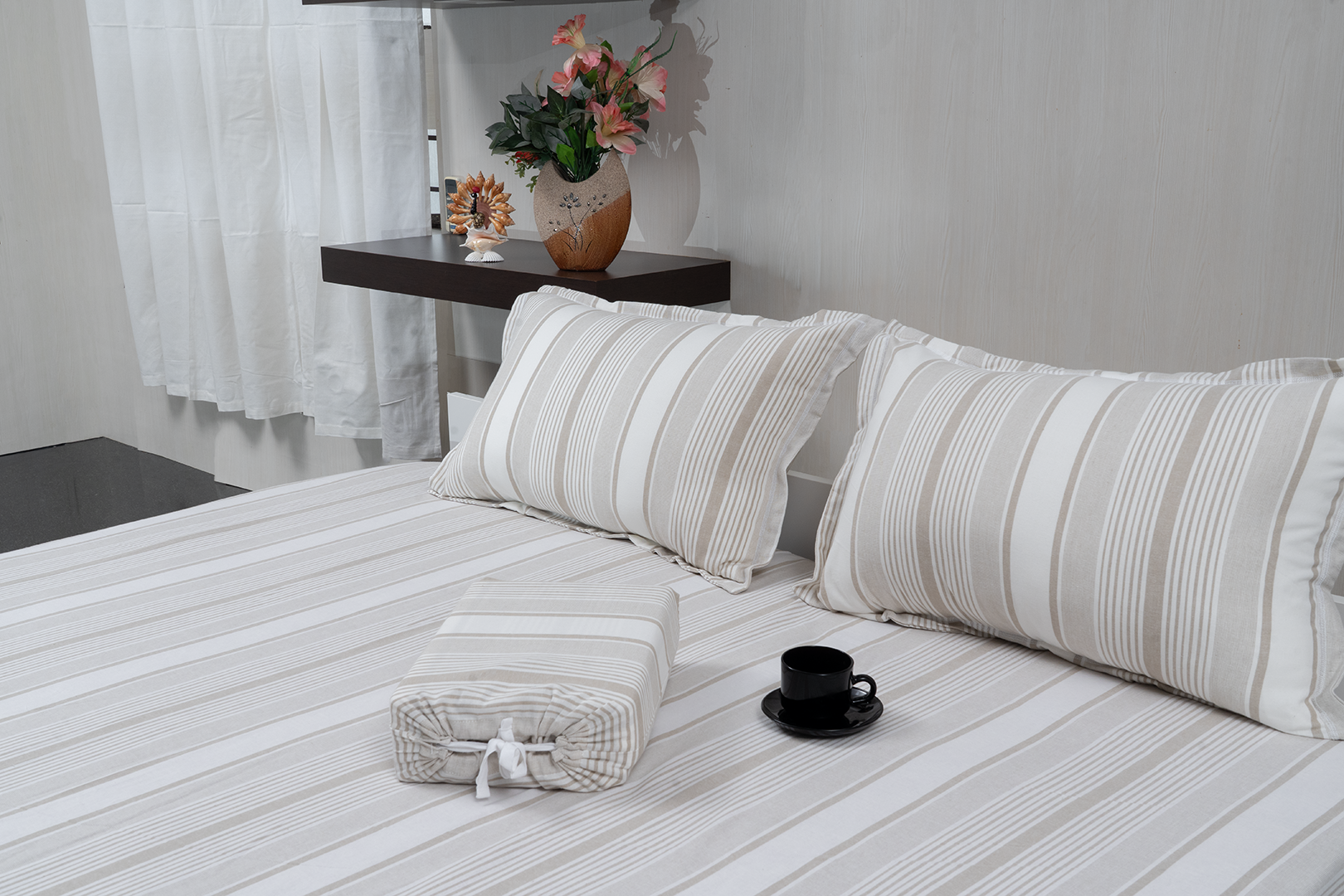 Linn Decors fitted sheet with two pillow covers and quilt styled on a modern bedroom bed