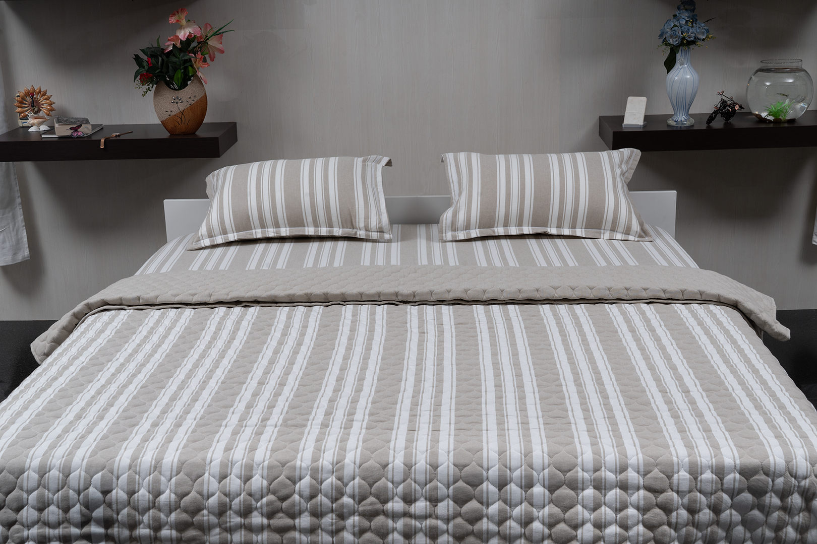 Linn Decors fitted sheet with two pillow covers and quilt styled on a modern bedroom bed