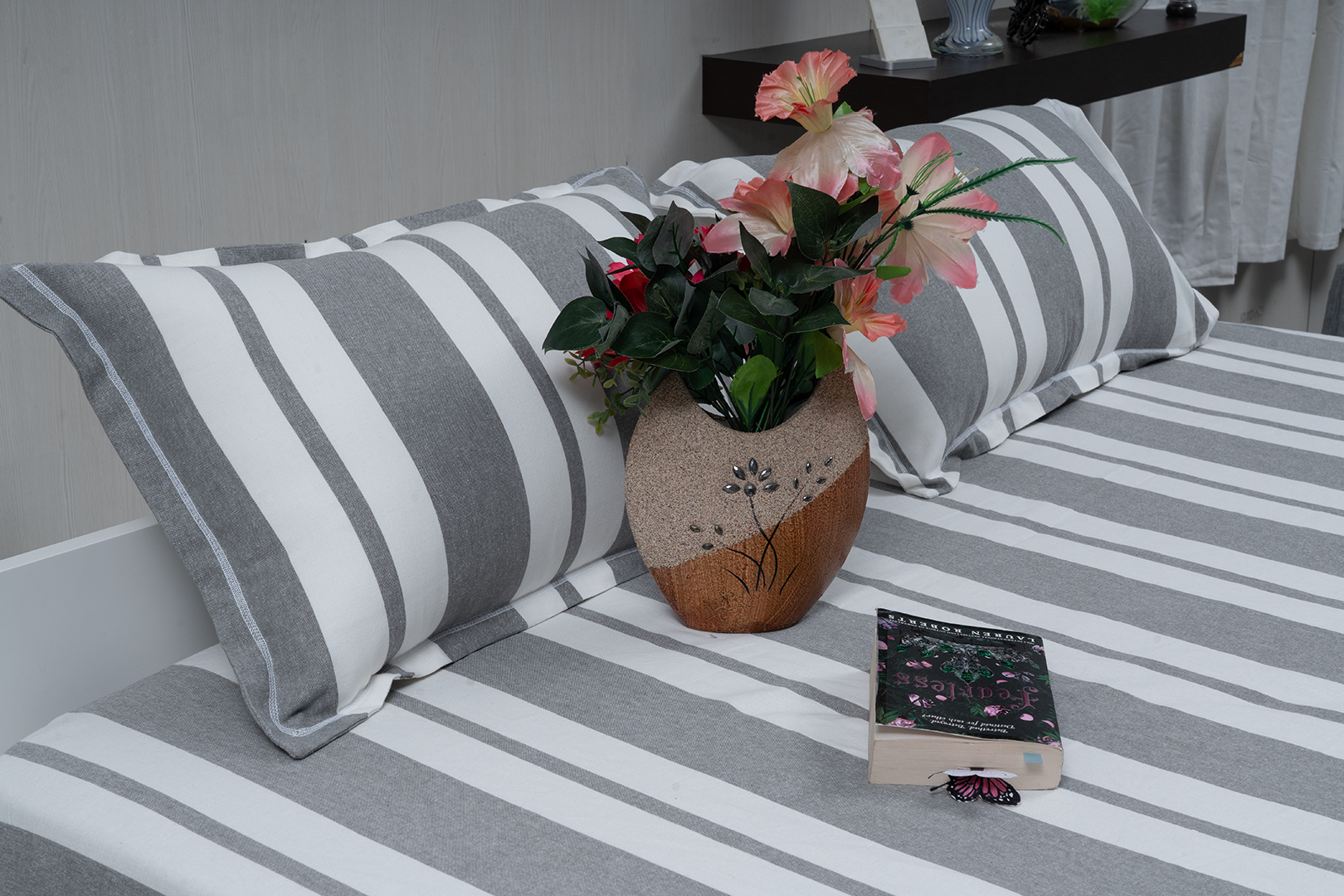Linn Decors fitted sheet with two pillow covers and quilt styled on a modern bedroom bed