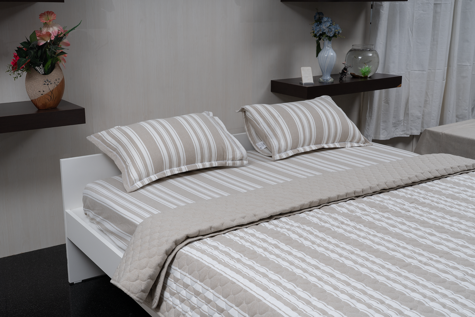 Linn Decors fitted sheet with two pillow covers and quilt styled on a modern bedroom bed