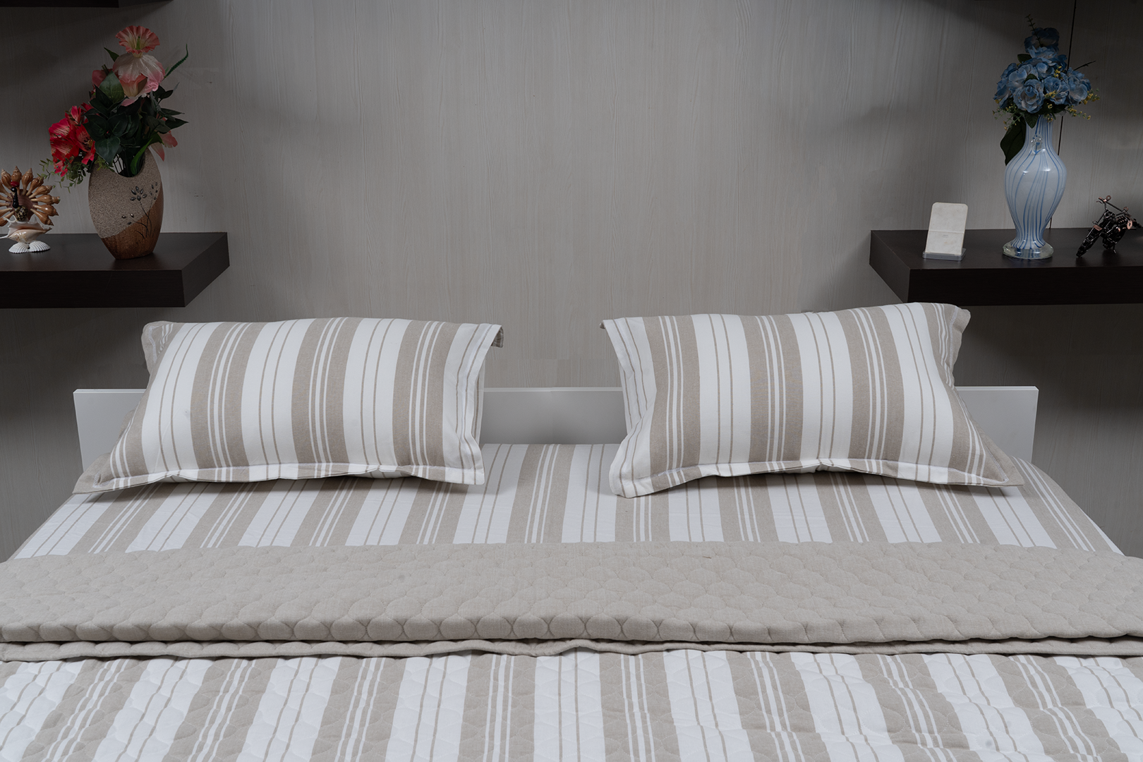 Linn Decors fitted sheet with two pillow covers and quilt styled on a modern bedroom bed