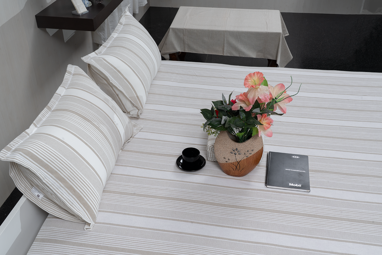 Linn Decors fitted sheet with two pillow covers and quilt styled on a modern bedroom bed