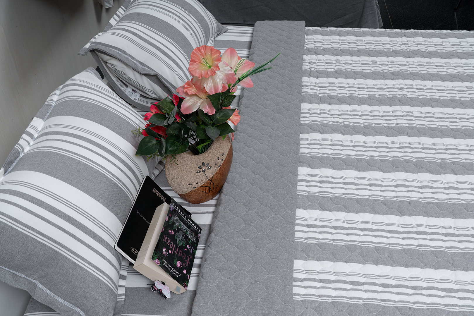 Linn Decors fitted sheet with two pillow covers and quilt styled on a modern bedroom bed
